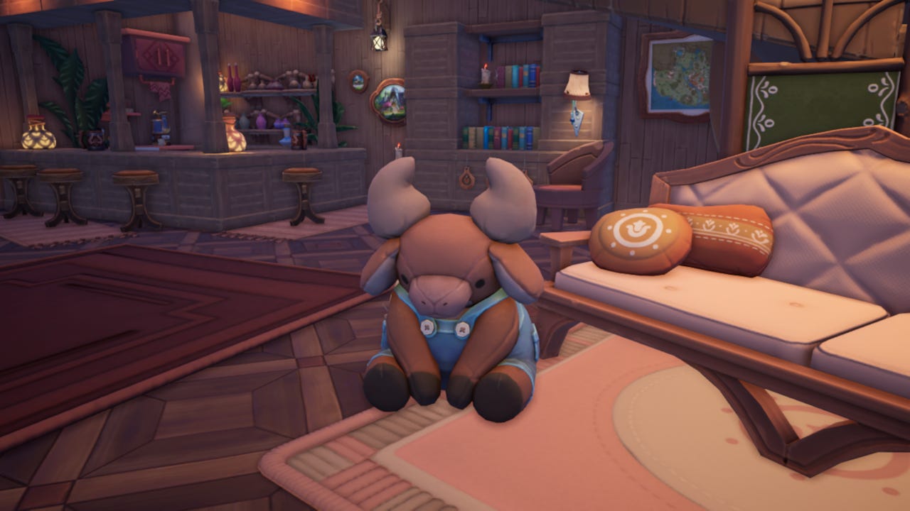 An in-game screenshot of Palia: the focus of the picture is a very cute cow-like plushie wearing blue dungarees. The background is a warm brown room with a cosy bar, bookshelf and couch.