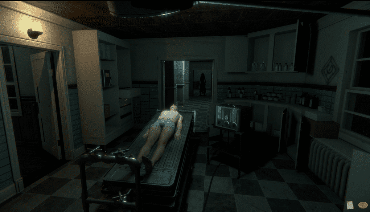 A screenshot of the main lab room from The Mortuary Assistant. A deceased body is lying on the embalming table. Down the hall in the distance, we can see the vague shape of a feminine figure. The environment is sterile and uninviting.