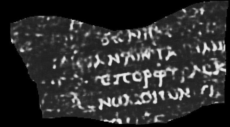 Scan showing a fragment of papyrus in black, with Greek letters visible in white. Scan showing a fragment of papyrus in black, with Greek letters visible in white.