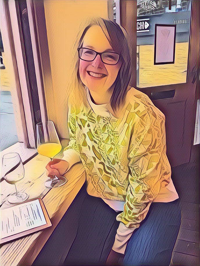 Jane a middle aged white woman with brown shoulder length hair sits in a bar smiling with a glass of wine. she's wearing a yellow patterned top, angular brown glasses. stylised image