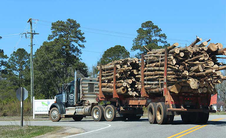 A loaded logging truck pulls into the Enviva biomass wood pellet plant in Northampton, North Carolina.