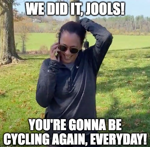 American Vice President Kamala Harris, holding her phone, with the caption "We did it, Jools! You're gonna be cycling every day!" written over it.
