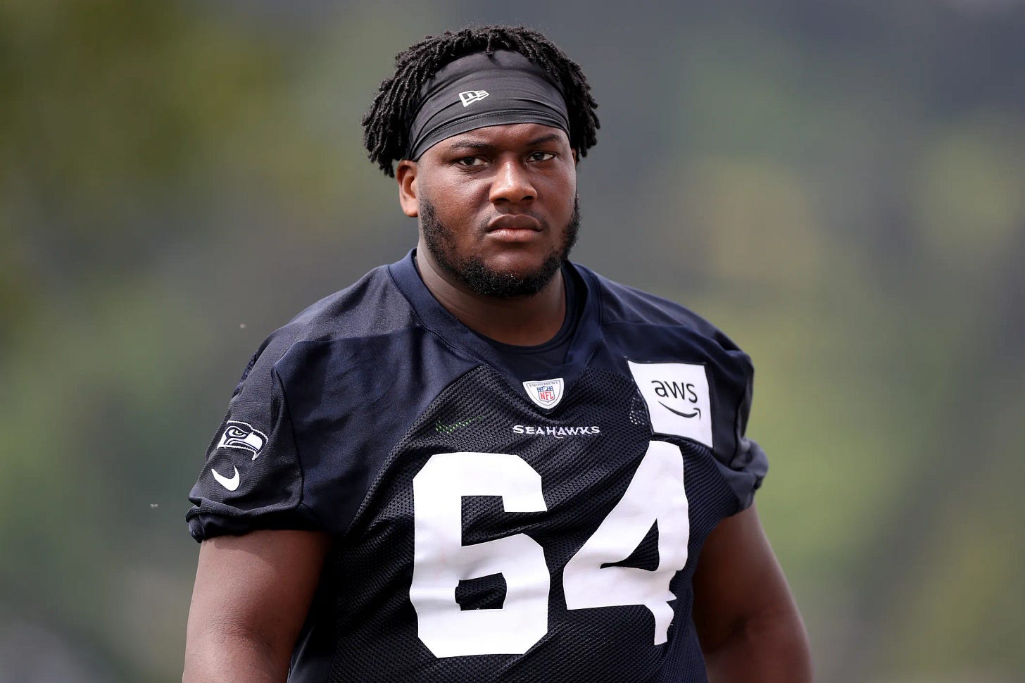 RENTON, WASHINGTON - MAY 03: Christian Haynes #64 of the Seattle Seahawks looks on during Seattle Seahawks rookie minicamp at Virginia Mason Athletic Center on May 03, 2024 in Renton, Washington. (Photo by Steph Chambers/Getty Images)