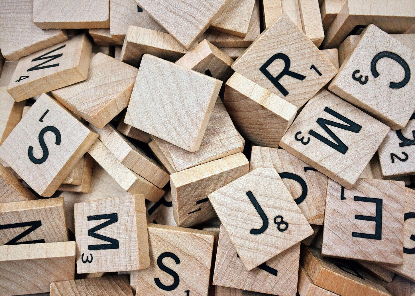 Scrabble letters in a pile.
