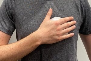 Person demonstrating use of a handheld device for heart disease screening Credit: Acoustics Lab