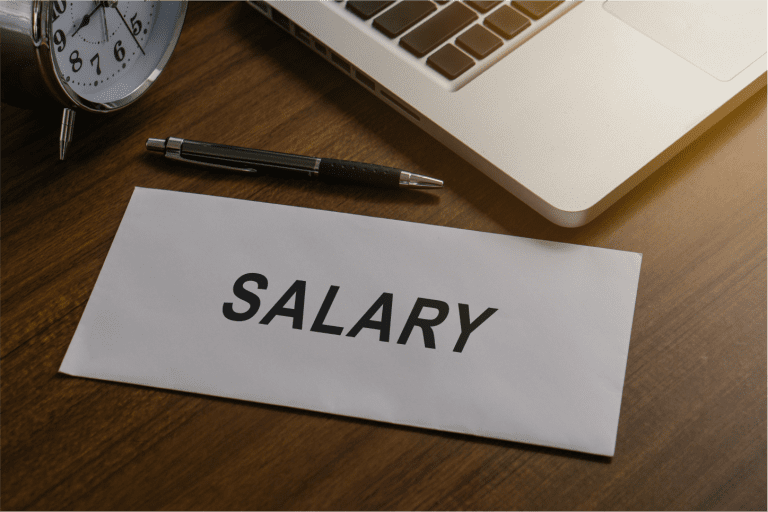 salary in paper envelope at workplace
