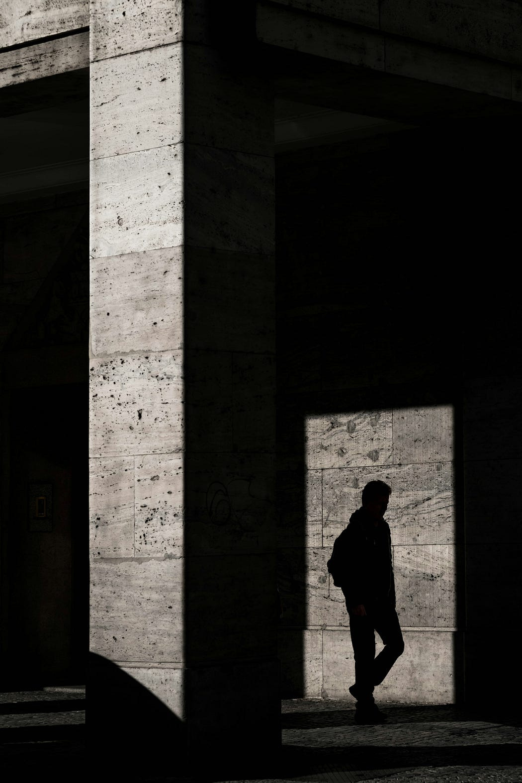 Shadowy figure standing in the doorway.