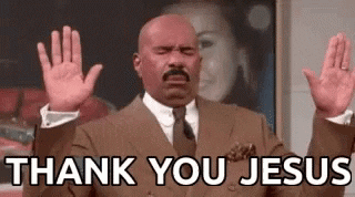 A GIF of Steve Harvey looking up and raising his hands miming ‘thank you Jesus’