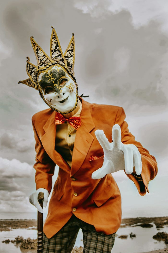 Man in Carnival suit and mask.