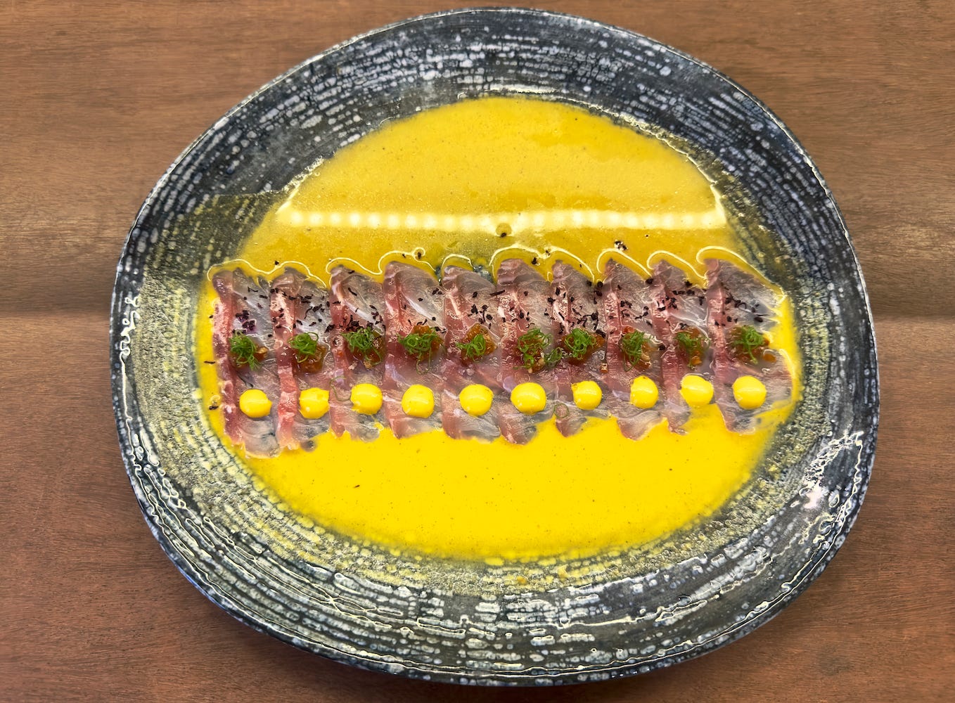 Tiradito at Tomo-delicate slices of fish bathed in a creamy yellow pepper sauce