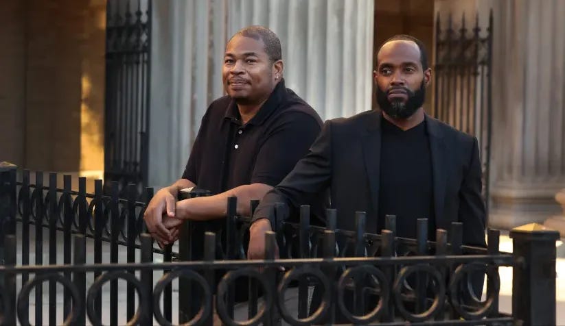 Former Lincoln Park High School basketball coaches Larry Washington, left, and Pat Gordon outside the school on Oct. 23, 2024, in Chicago. After years of litigation, CPS lawyers will be asking the Board of Education to approve two settlements of more than $1 million in total with the coaches. (Stacey Wescott/Chicago Tribune)