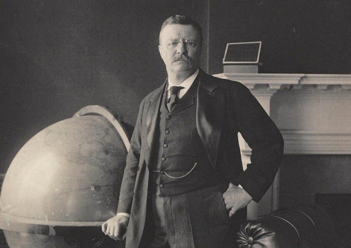 Theodore Roosevelt, full-length portrait, standing beside large globe,  facing front] | Library of Congress