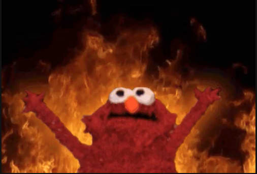 Elmo surrounded by flames against a black background