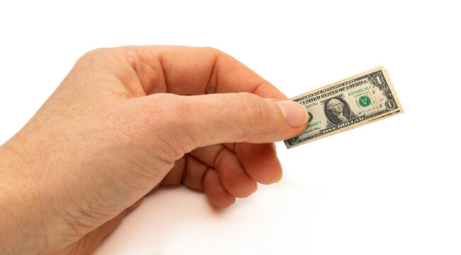 A hand holding a stack of money

Description automatically generated with low confidence