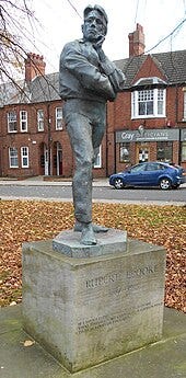 Statue of Brooke in Rugby, by Ivor Roberts-Jones (1988)