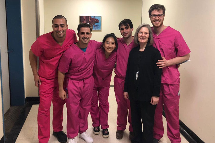 Ricardo with his fellow MD students and Sherry A. Downie, Ph.D.