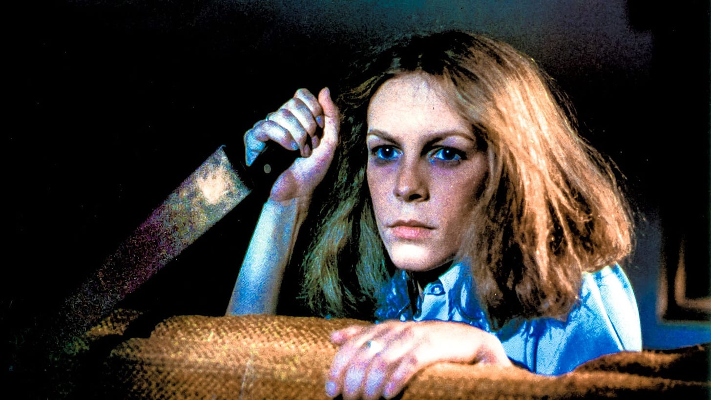 Halloween | Still features Jamie Lee Curtis as Laurie Strode wielding a knife.