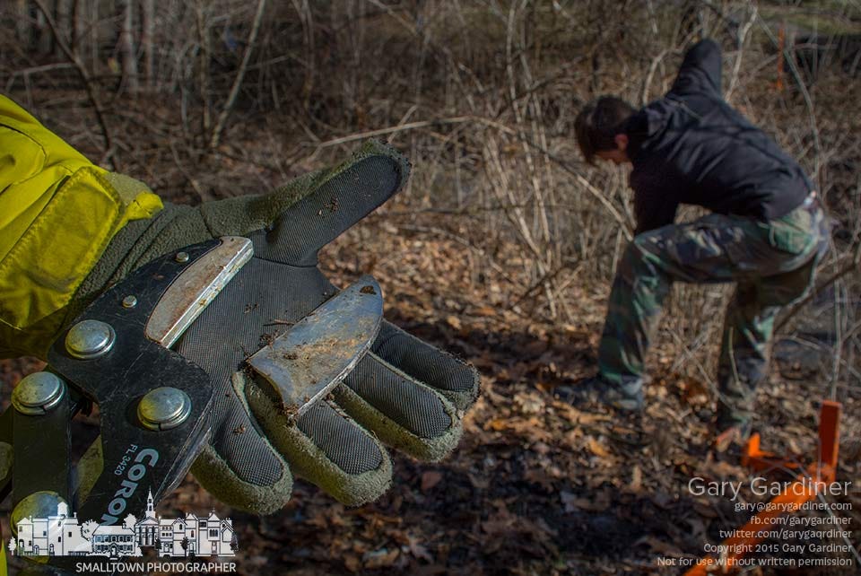 A volunteer displays the broken cutter on the tool he tried to use to cut honeysuckle from the riparian of a creek during an invasive species clearing operation in Westerville. My Final Photo for March 28, 2015.