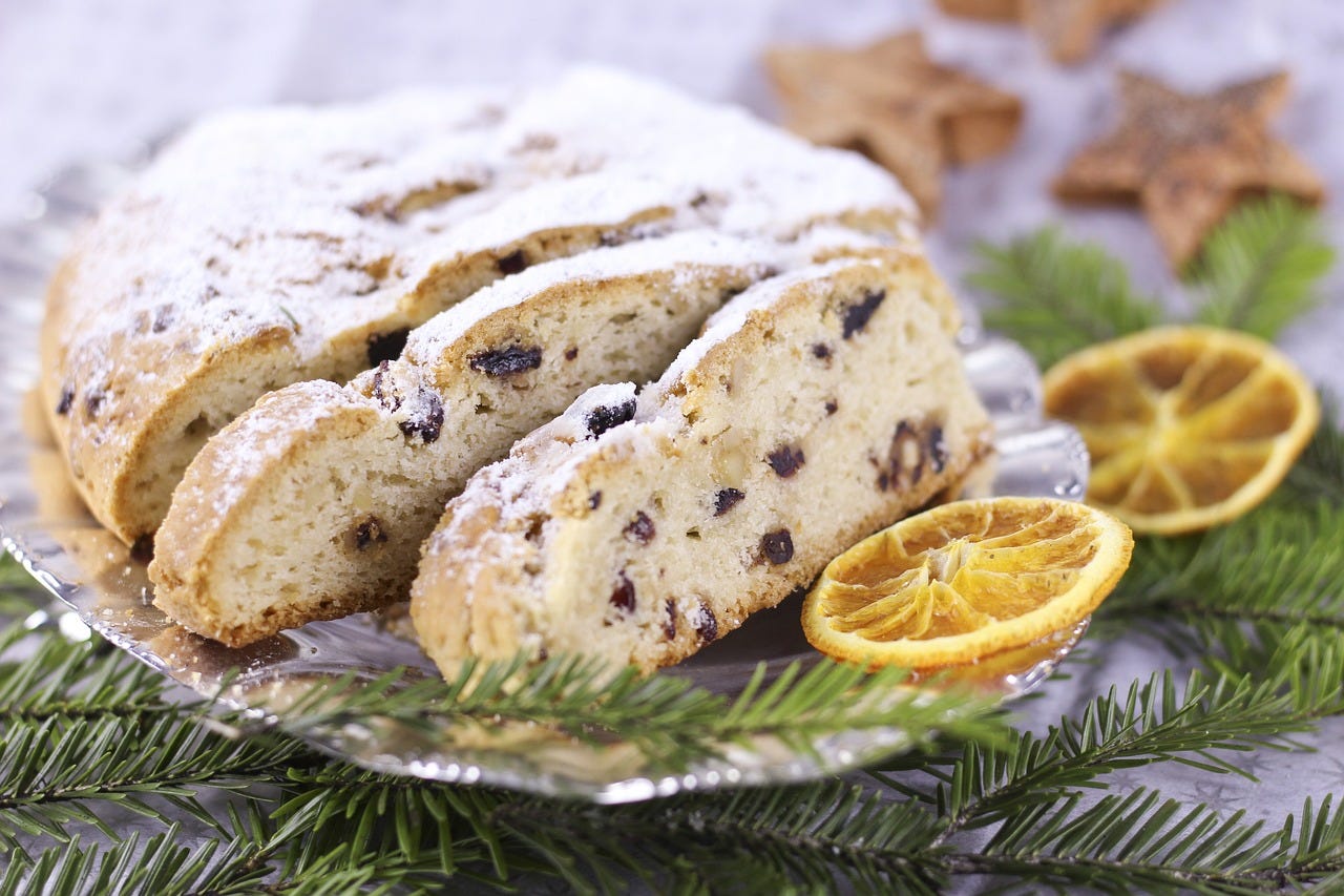 German Christmas confection or stollen. Lots of powdered sugar and dried fruits in a loaf cake.