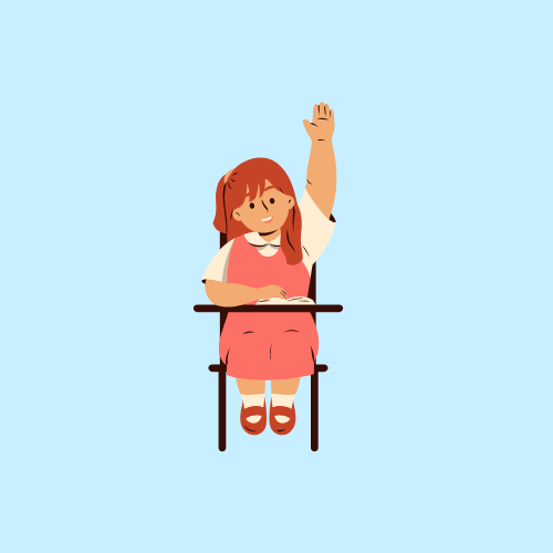 A girl wearing a pink dress sat at a desk, raising her hand