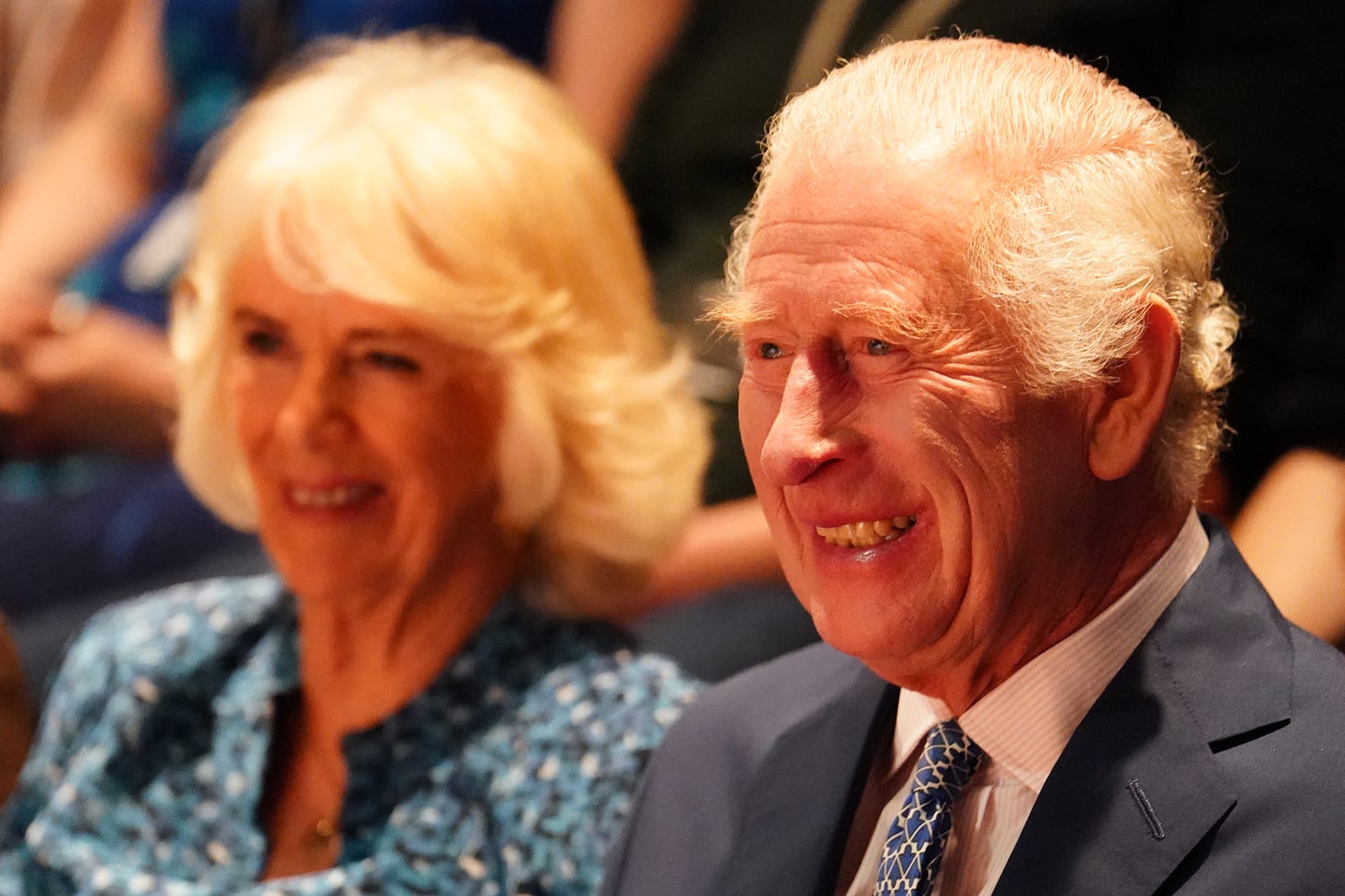 Smiling King XCharles next to Queen Camilla