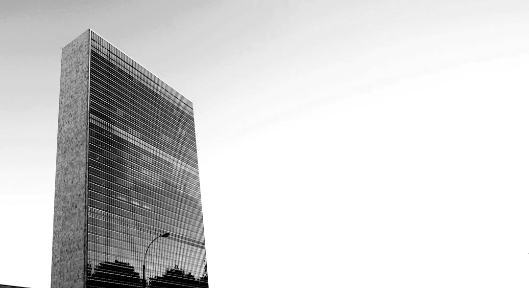 low angle photo of curtain wall building at daytime