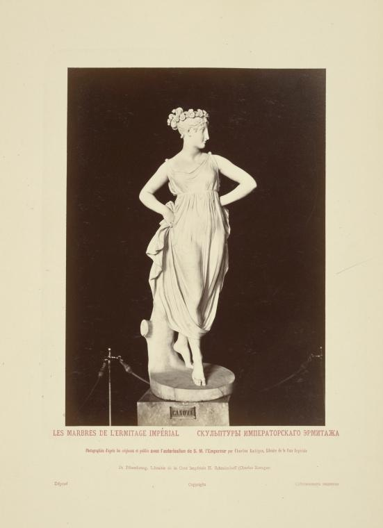 Photo of statue of a woman, hands on hips