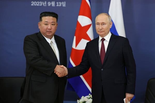 Kim Jong-un and President Vladimir V. Putin shaking hands.