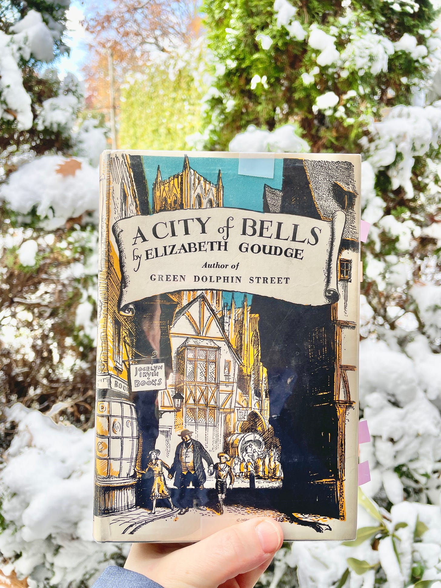 My copy of  A City of Bells out in the snowy garden.