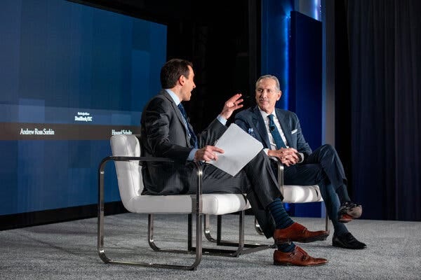 Andrew Ross Sorkin, left, speaking with Howard Schultz, Starbucks&rsquo;s chief executive, during The New York Times&rsquo;s DealBook policy forum.