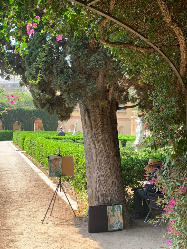 a view of the pathways and hedges of the Old Parterre, with an artist and some of his painting in the mid ground