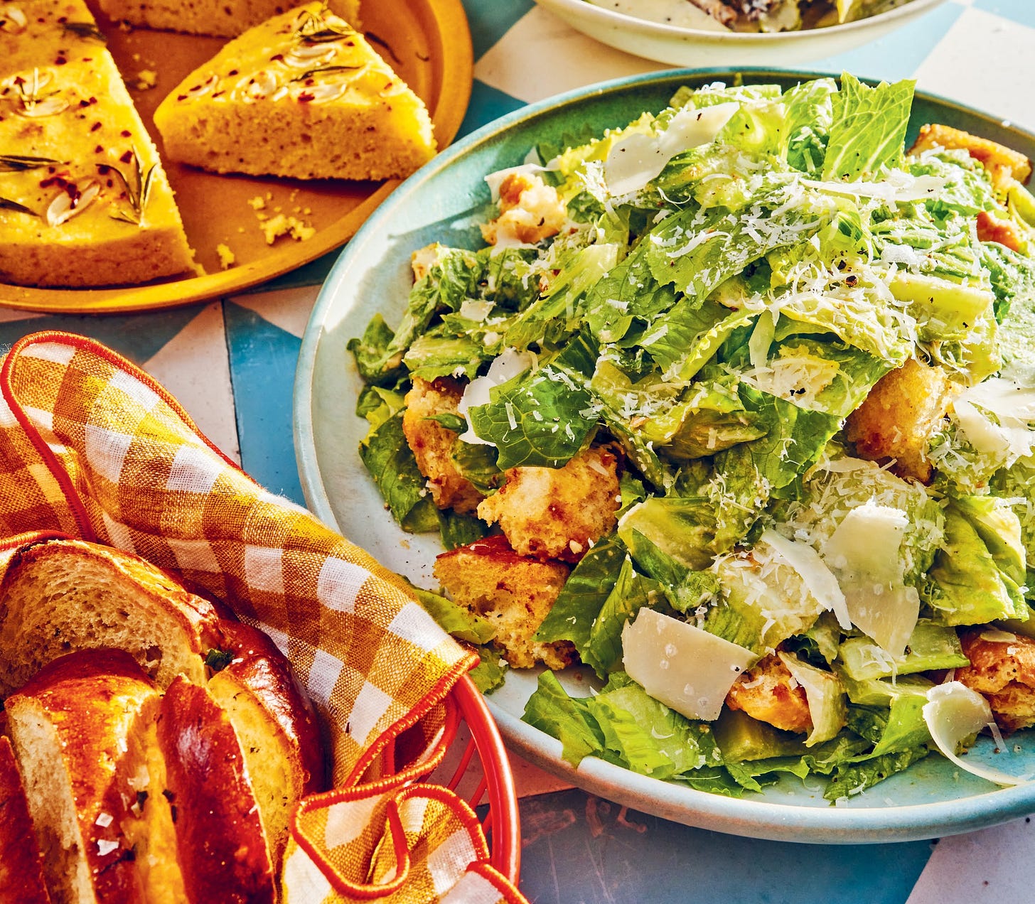 Platter of caesar salad with croutons and Parmesan.