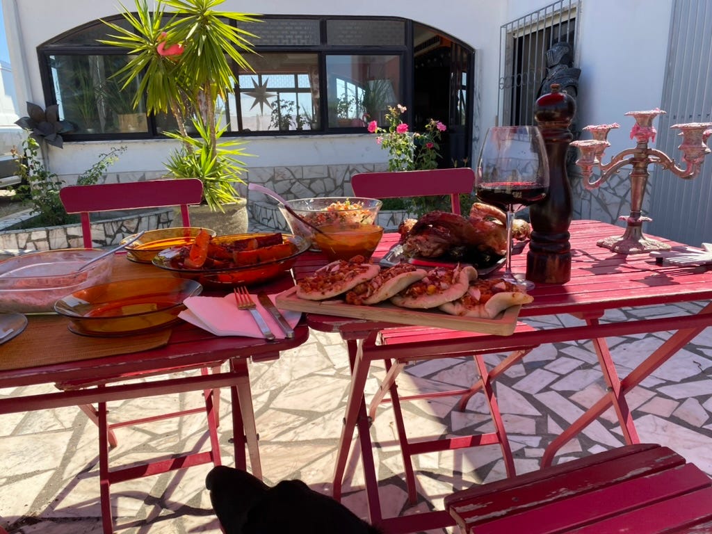 Red outside tables with food on top