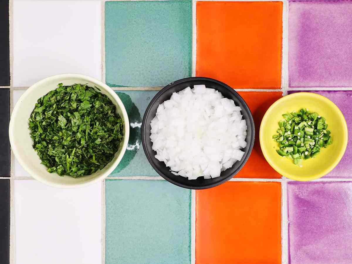 Bowls of Chopped Cilantro Onion and Serrano Peppers