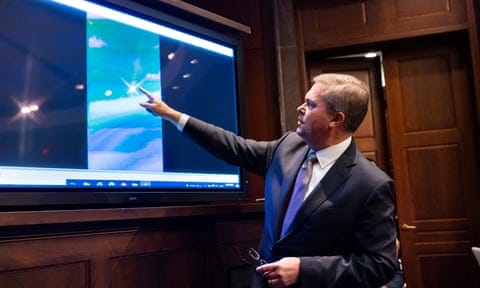Scott Bray, deputy director of naval intelligence, plays a video of unidentified aerial phenomena during a House intelligence committee hearing in May 2022. 