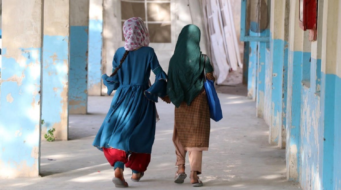 File image of Afghan girls heading into a school building in Kandahar in September 2022