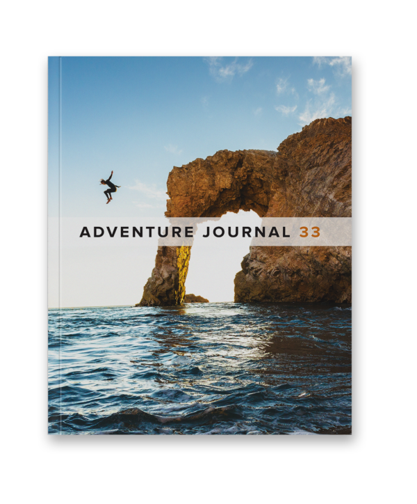 Adventure Journal 33 cover with arch in water.