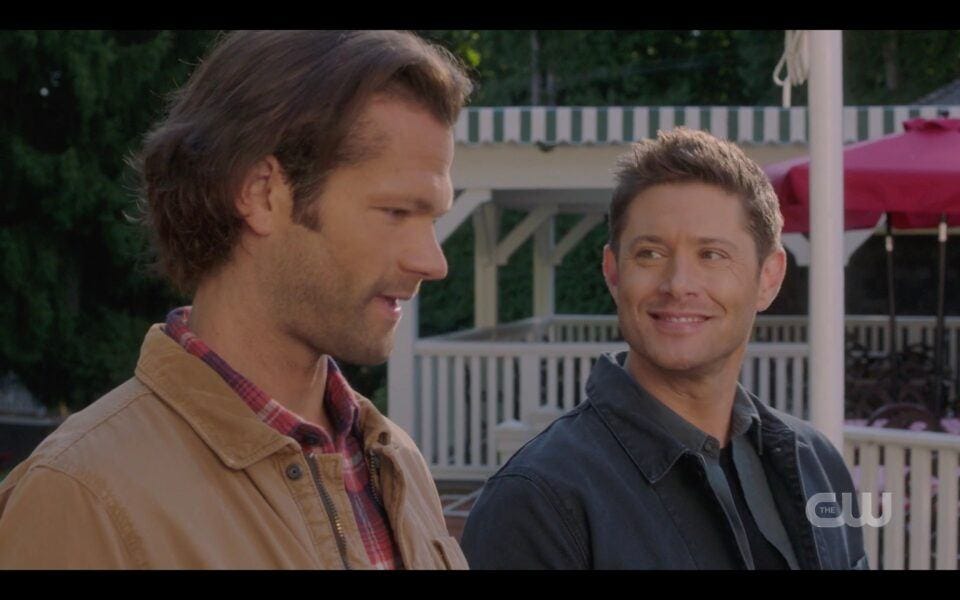 SPN Dean Winchester smiling wide with pies at Sam Winchester