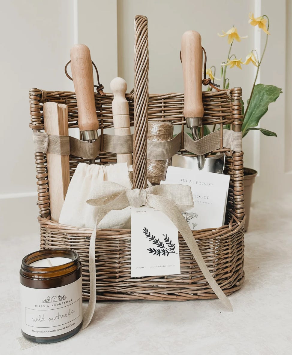 basket with gardening tools making up a hamper