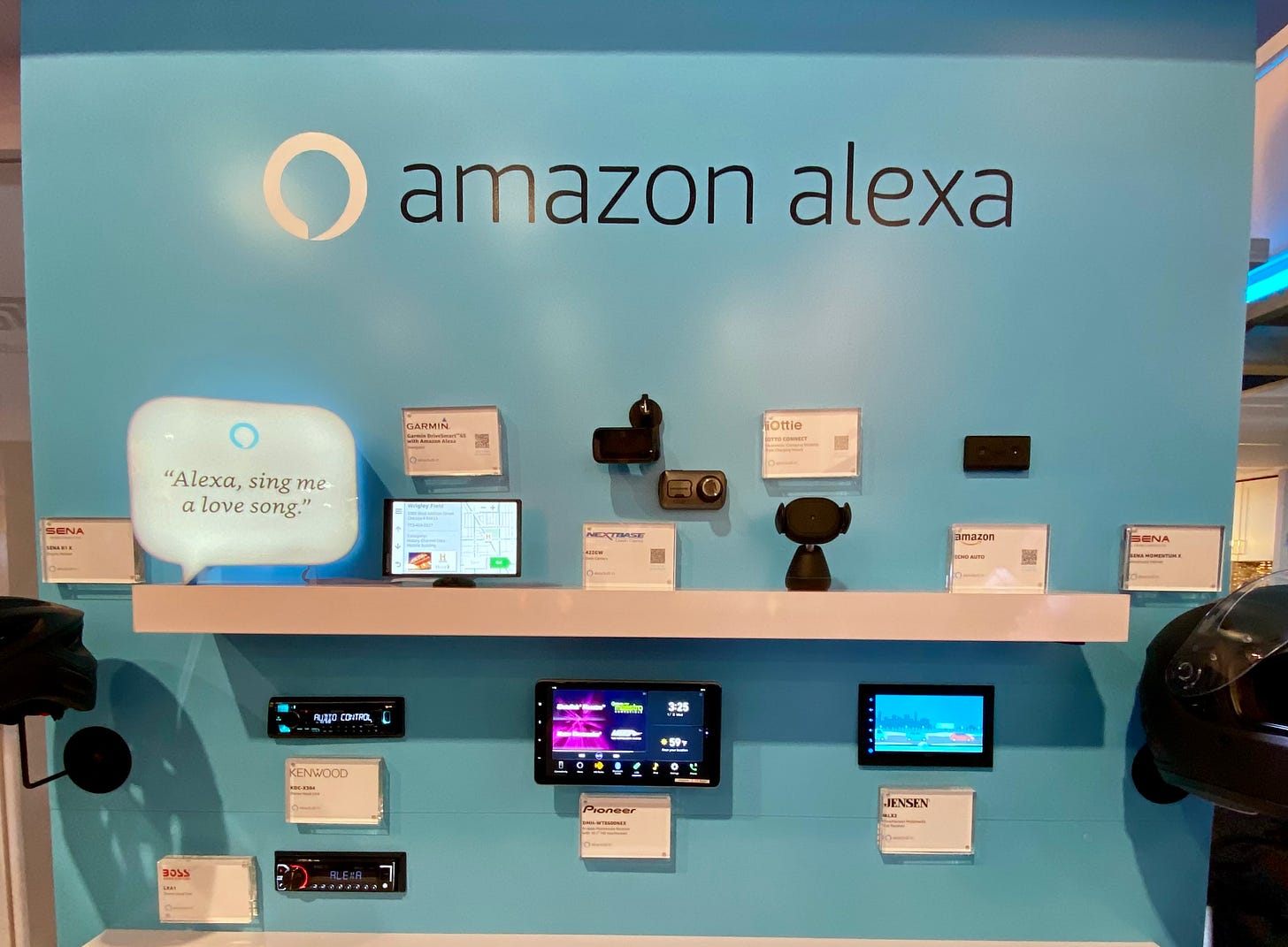 A trade show booth showing off all the places Alexa integrates inside an automobile.