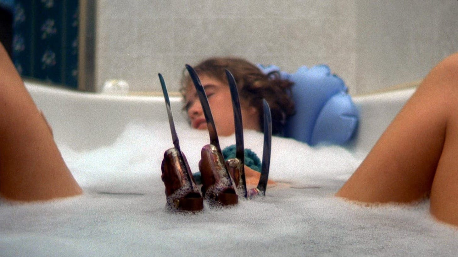 A Nightmare on Elm Street | Still features Heather Langenkamp as Nancy Thompson in the bed with Freddy Krueger's bladed glove emerging between her legs.