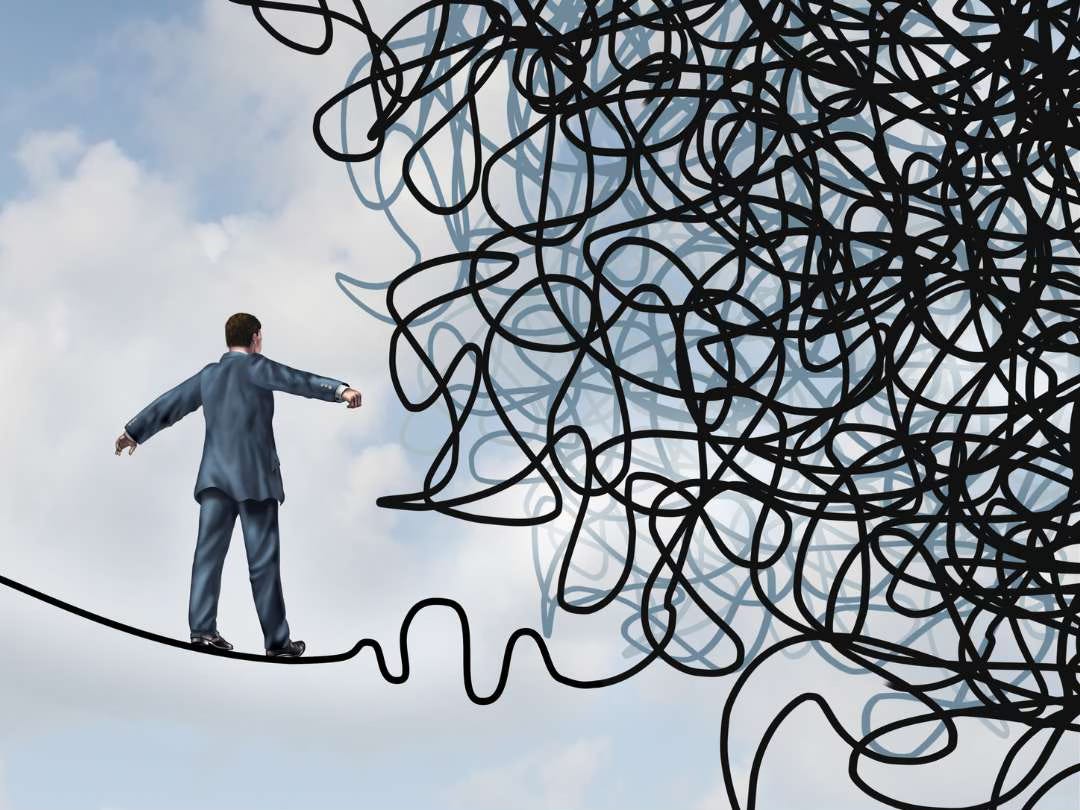 Graphic of a man in a suit, balancing on a highwire of thread. The thread just ahead of him becomes a massive tangle, seemingly impossible to navigate.