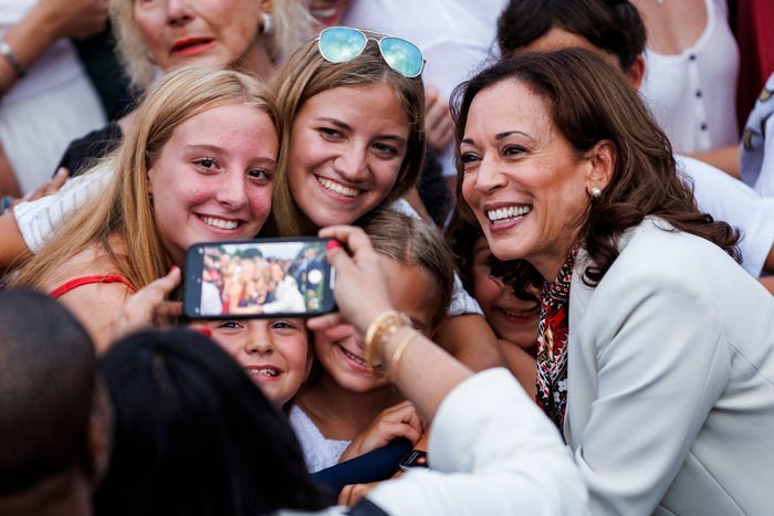 US Vice President Kamala Harris taking pictures with some young teen girls.