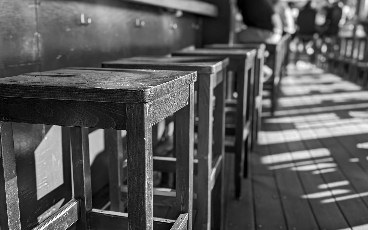 Stools sun themselves on a quiet afternoon at the local pub