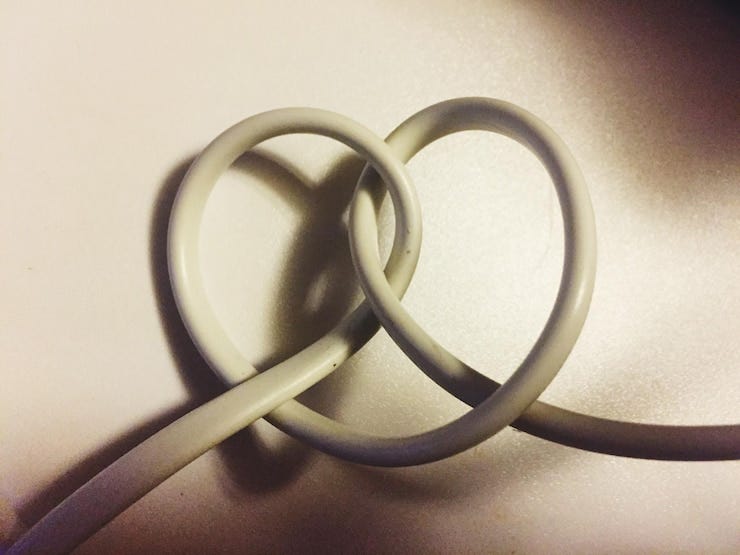 Close-up of cable forming heart shape on table