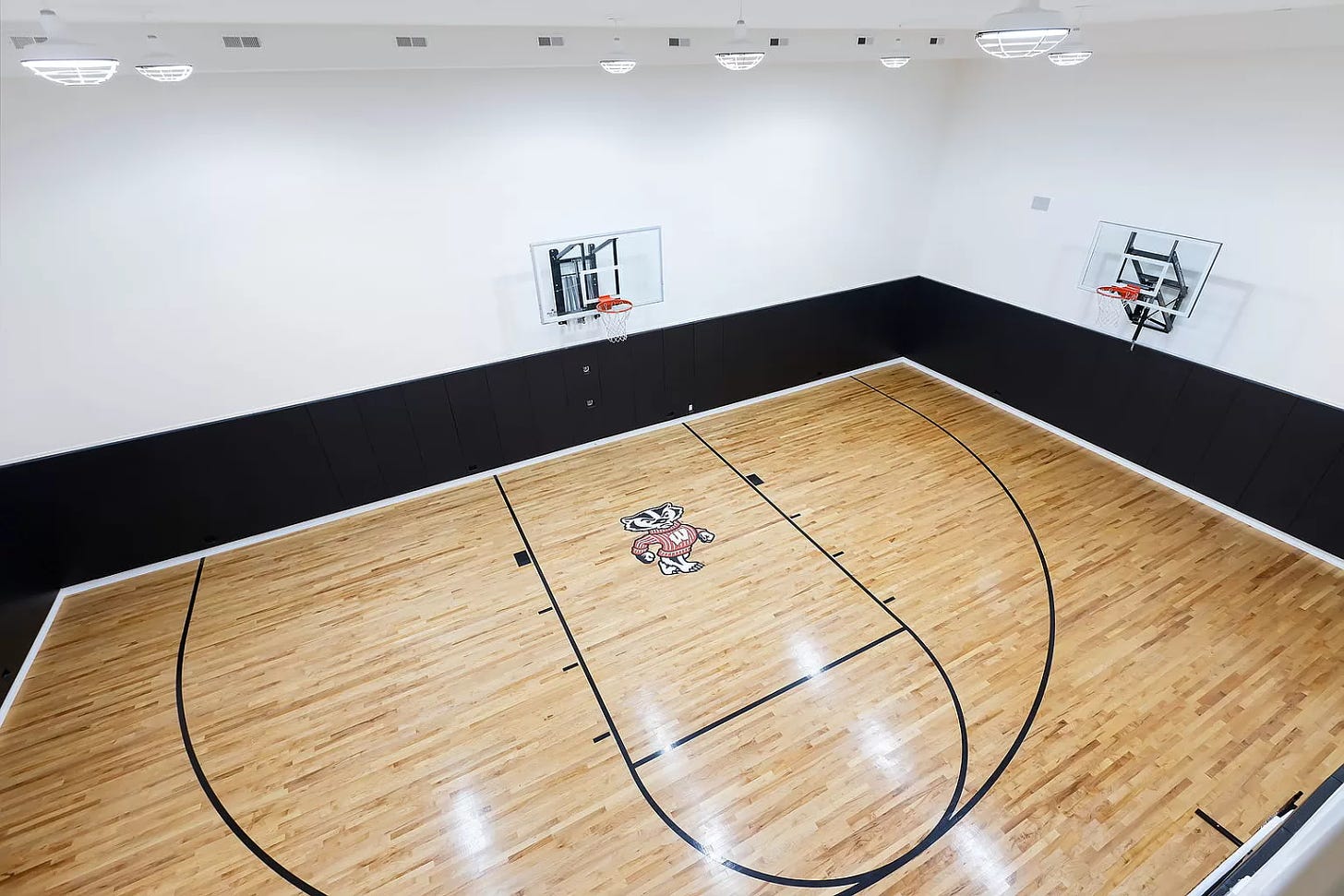 A giant half-basketball court. There's a Wisconsin Badger painted on the floor in the "paint" area. The rest of the room is -- you guessed it -- black and white. 