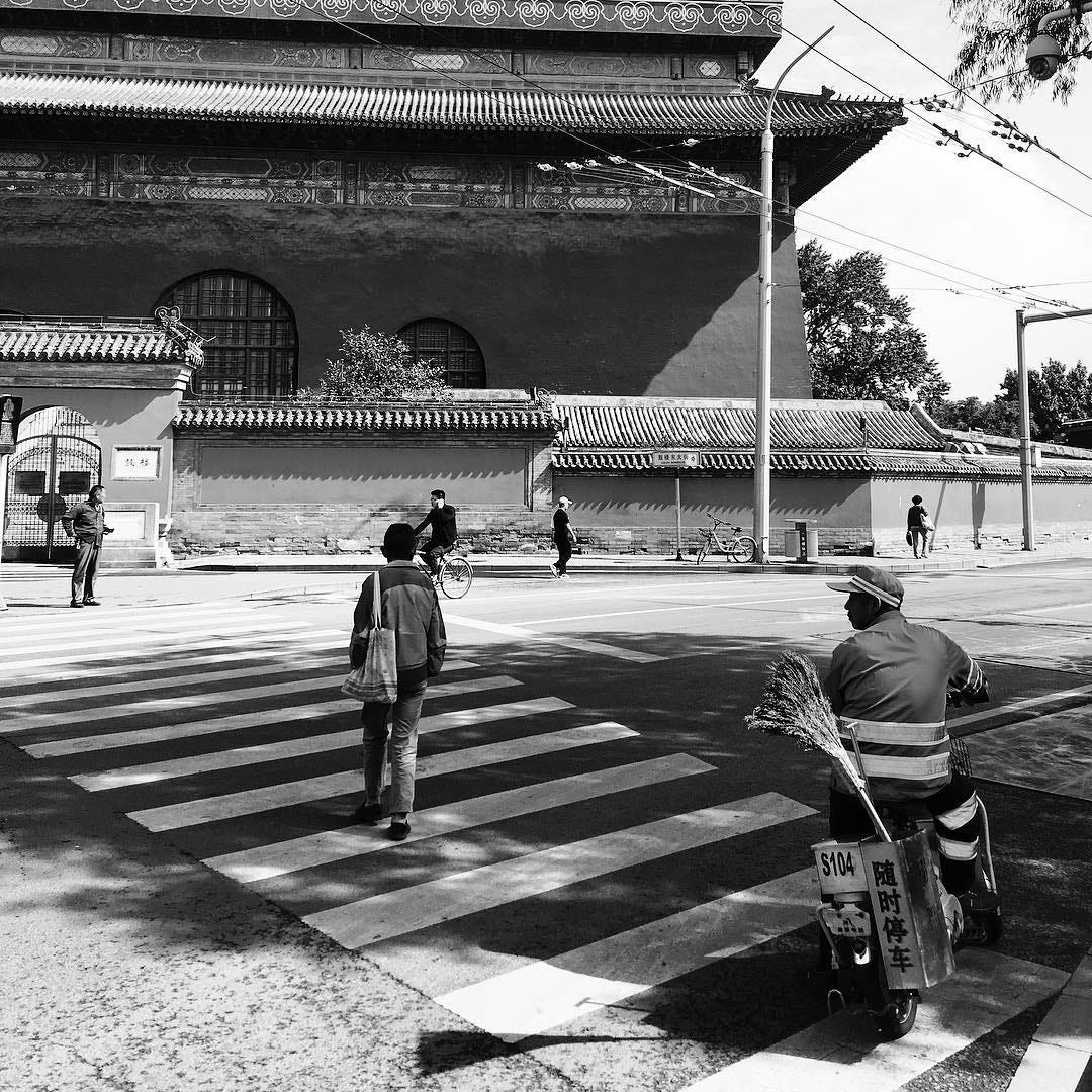 A snapshot of life in Beijing, with the Drum Tower in the background..