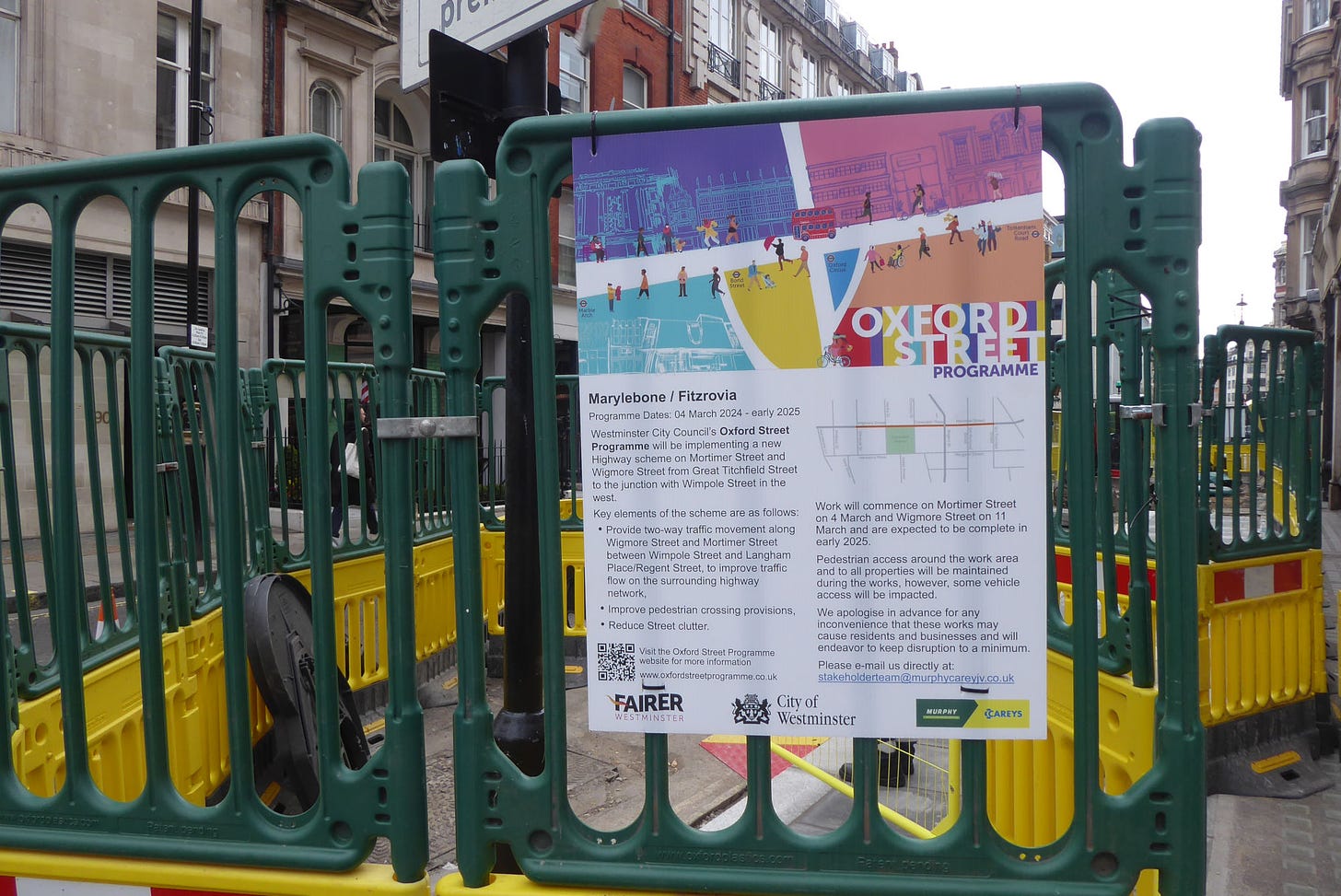 Oxford Street Programme works signs on Mortimer Street with updates of project progress.