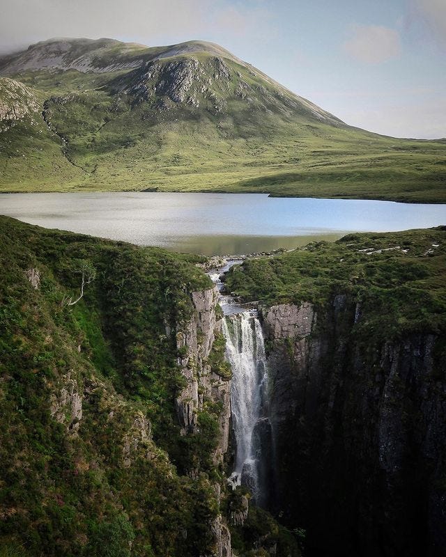 May be an image of nature, waterfall and mountain