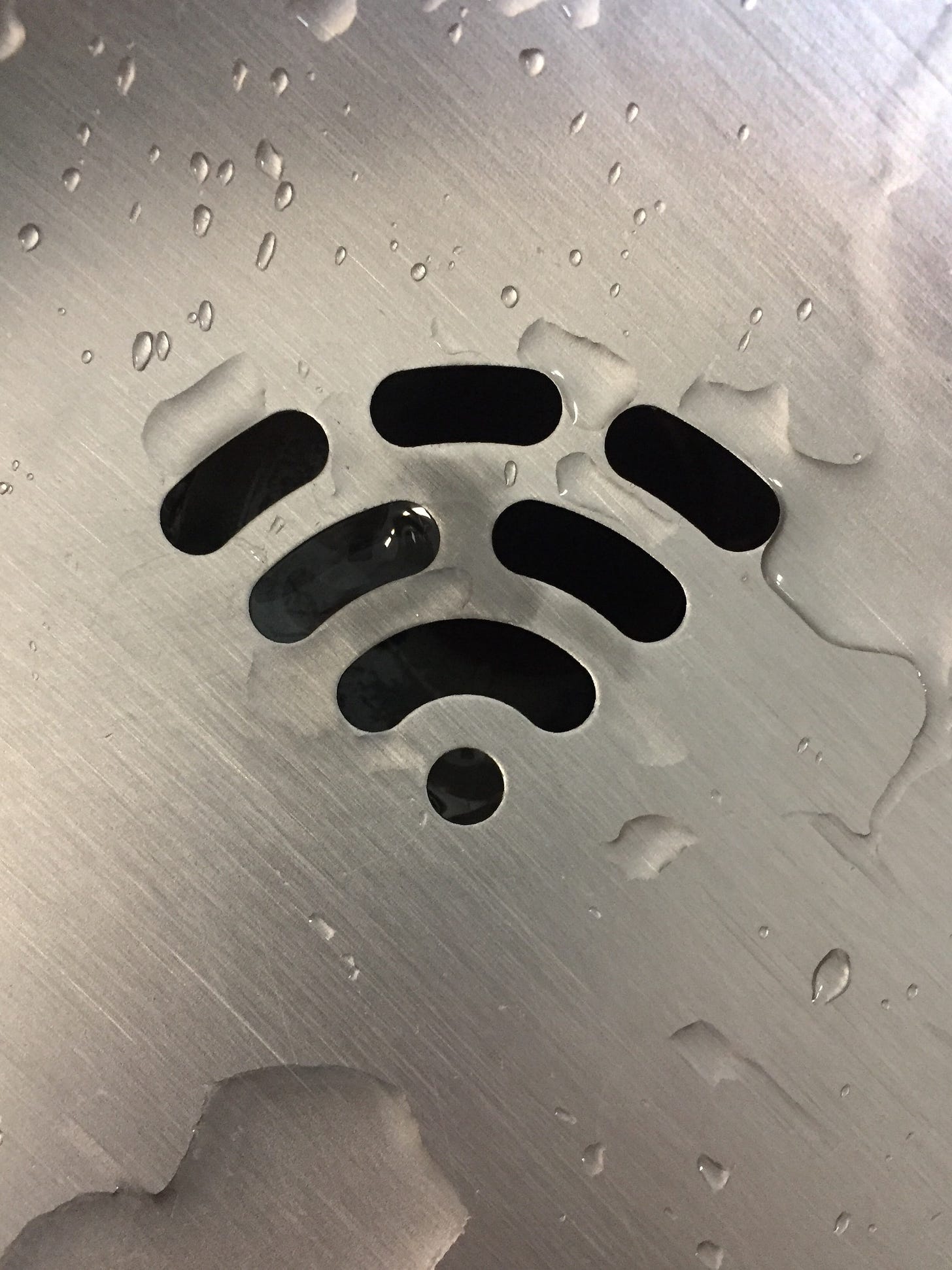 A water fountain drain that looks like the Wi-Fi symbol. Honeygain users earn points that they can convert to cash